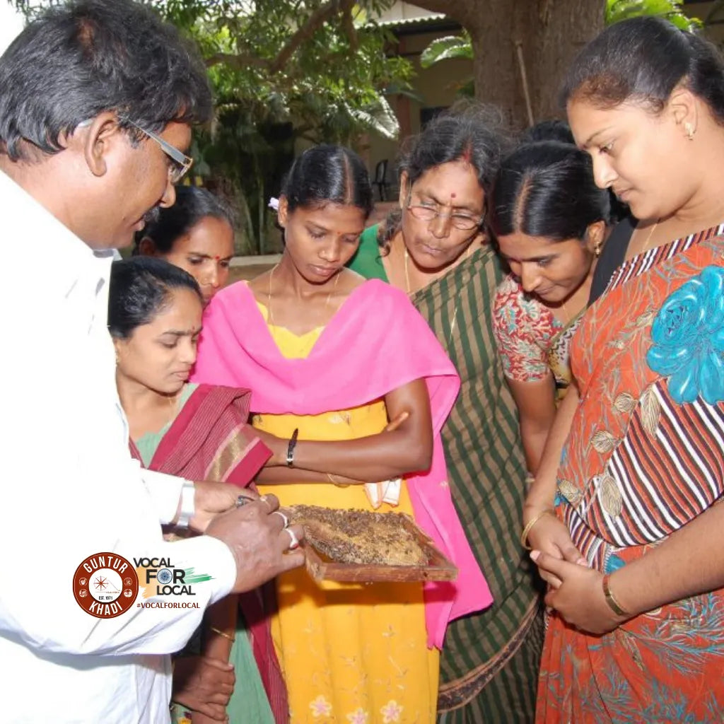 Rural beekeepers trained by Guntur Khadi working with hives to produce pure honey