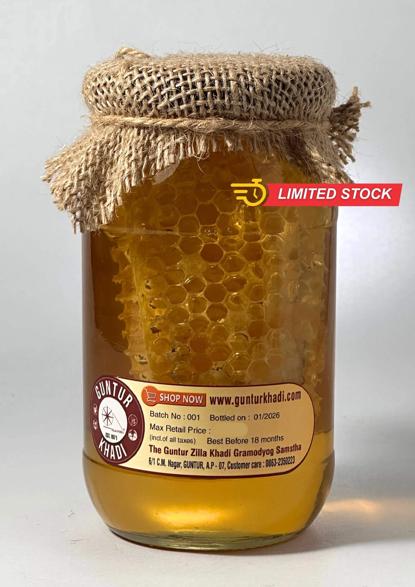 Back view of raw honey with comb packaging showing product information