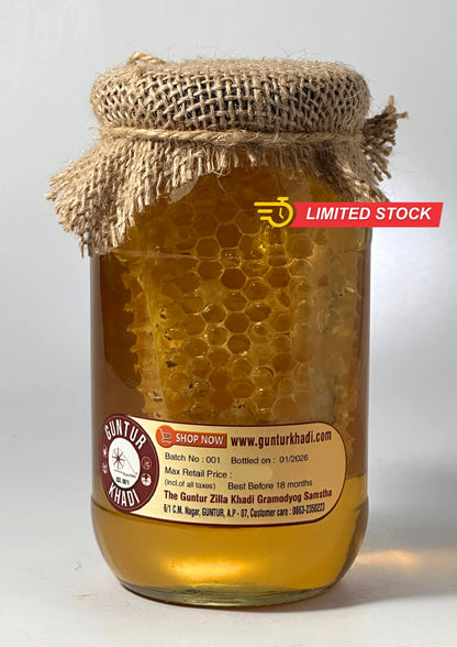 Back view of raw honey with comb packaging showing product information
