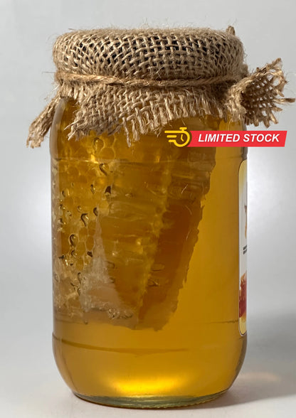 Side view of raw honey with comb showing natural honeycomb texture